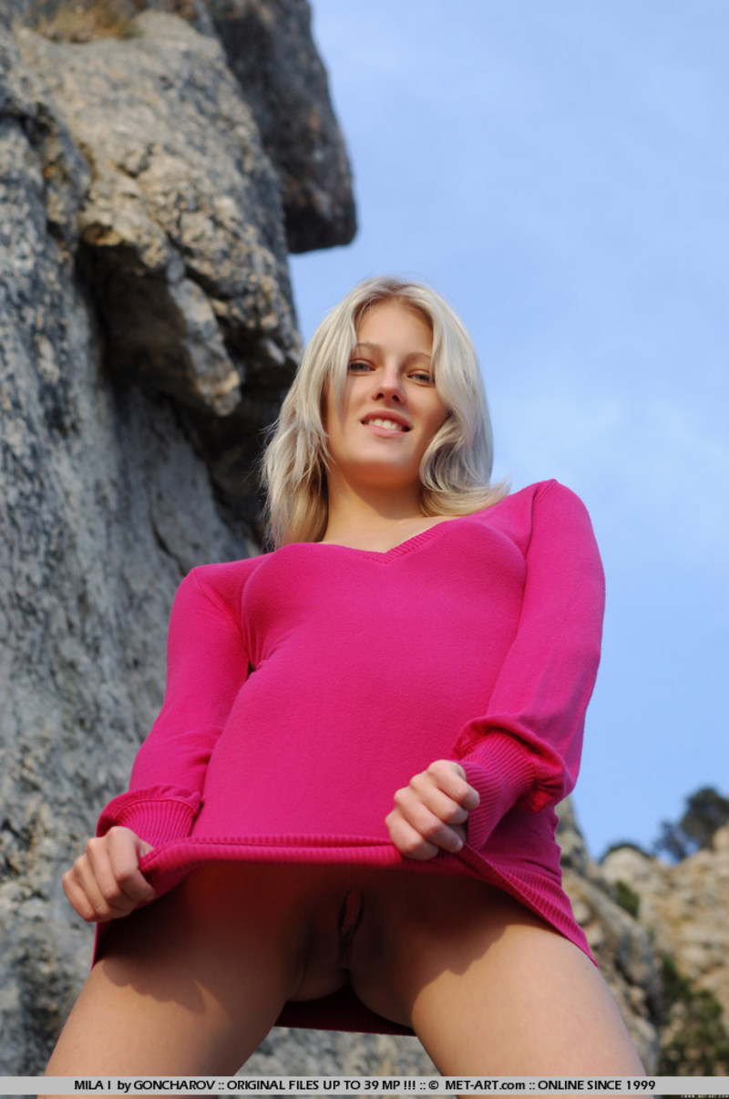 Mila in soft pink top shows pussy on the hillside - Pic #0